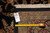 Back tag reading 8 x 10.1 beside tape measure confirming size on genuine hand-woven rug