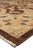 Beige guard border and brown outer stripe in close detail beside soft ivory wool fringe