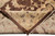 Folded corner revealing the even hand-knotted back, cotton foundation weave and tight wool knotting