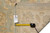 Back of rug with tag reading F-4336, size 7'11" x 10'1", beside a tape measure