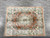 8 x 10 Chinese bamboo silk rug photographed on grey tile floor showing full Aubusson layout