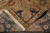 Folded corner revealing the tight hand-knotted back, cotton foundation and ivory fringe of the rug
