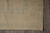 Corner and ivory fringe of the 8x11 Oriental rug with layered square panel border bands