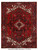 Deep red Persian Heriz rug with navy border, ivory corner spandrels and stepped geometric center medallion