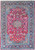 Red field Persian Najafabad rug with navy floral border and ivory vine scrollwork, overhead view