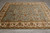 8'1" x 10'2" Jaipur Oriental rug displayed on grey tile floor, soft aqua field