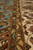Border detail with olive green guard band beside ivory main border, pink and gold flowers