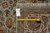 Back tag reading F-4528 with tape measure confirming the 8'1" x 10'2" size