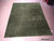 8' x 10' hand-knotted Indian Gabbeh rug viewed at an angle on a showroom floor