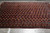 Overhead angle showing the all-over gul lattice and wide ivory latch hook end border
