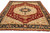 7'9 x 9'10 Serapi rug photographed from the corner, ivory medallion centered on deep rust ground
