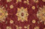Macro close-up of an 8 petal gold rosette woven in plant-dyed organic wool