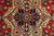 Close-up of navy 8 pointed medallion with ivory octagon, light blue outlines and tan rosettes