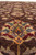 Field close-up of gold and red lotus palmette with blue and olive serrated leaves