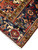 Corner and ivory fringe of this vintage Persian village rug with navy and camel borders