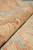 Rolled edge showing thick hand-spun wool yarns, coral motifs and soft aqua pile texture