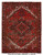 7'6" x 9'9" Persian Heriz rug shown flat with brick red field, navy medallion, ivory spandrels