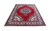 Full angled view of 9x12 hand-knotted Tabriz rug showing red field and ivory borders