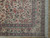 Corner detail showing soft rose main border, ivory guard stripes and thick white cotton fringe