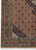 Corner detail showing light blue vine border, gold guard stripes and ivory fringe on wool pile
