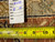 Back tag reading rug number 6433 and size 8 x 10 beside tape measure