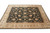 8' x 9'8" wool rug at low angle showing even pile, black field and beige border