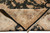 Folded corner revealing tight cotton foundation knots, black selvage and hand-spun wool pile