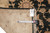 Back and tag of the 8' x 9'8" Peshawar rug with tape measure for scale