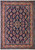 6'8" x 10'6" Persian Sarouk rug with navy floral field and salmon flowering border