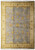 Full overhead view of 8x10 light blue Oushak rug with gold and ivory floral border