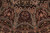 Radiating dome panels with burgundy cartouches and ivory pearl bands in this 8 by 8 round rug