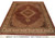 Brown and ivory Tabriz Mahi design wool rug displayed full length on showroom floor with inventory tag