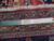 Ruler and Authentic Handmade label at rug edge confirming hand-knotted wool weave and fringe