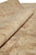 Rolled edge detail showing soft low wool pile and pale gold border panels