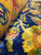Macro view of soft silky wool pile in cobalt blue, gold and rose tones
