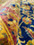 Rolled edge close-up revealing fine wool texture and jewel tone dyes of this rug