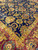 8x8 square Indian rug detail, gold vine border meeting deep navy floral field