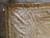 Detail of corner cartouche with pink ribbon scrolls, soft green leaves and small open areas