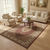 Beige living room styled with the 6'7" x 9'10" wool and silk Mahi rug under round table
