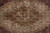 Detail of medallion core where silk highlights lift the olive, camel and ivory drawing