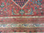 Detail of border stack with ivory palmette vine, guard stripes and blue vase motif above