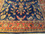 Coral main border with 8 petal rosettes, sage palmettes and navy bud motifs, close up