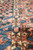 Macro of ivory guard stripe dividing the navy field from the salmon floral border