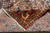 Folded corner revealing tight cotton foundation and hand-knotted back of the 7x11 Bakhtiar rug