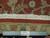 Ruler against the 8 x 10 Indian rug edge confirming authentic hand-knotted construction and wool pile