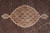 Ivory scalloped medallion with burgundy and beige florals floating on a black Herati fish ground