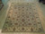 Soft green and ivory wool area rug with gold rust palmettes, full overhead view