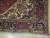 10x13 Persian Tabriz corner detail: ivory spandrel, navy floral border and clean cotton fringe