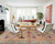 Light grey Kazak rug anchoring a bright white living room with sofa, chairs and wooden coffee table