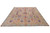 8x10 Kazak area rug photographed at an angle, grey border framing multicolored square garden panels